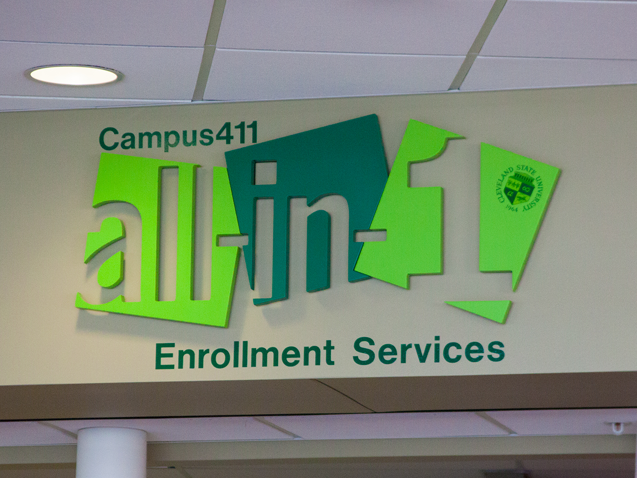 Photo of the sign for the offices of enrollment services at CSU
