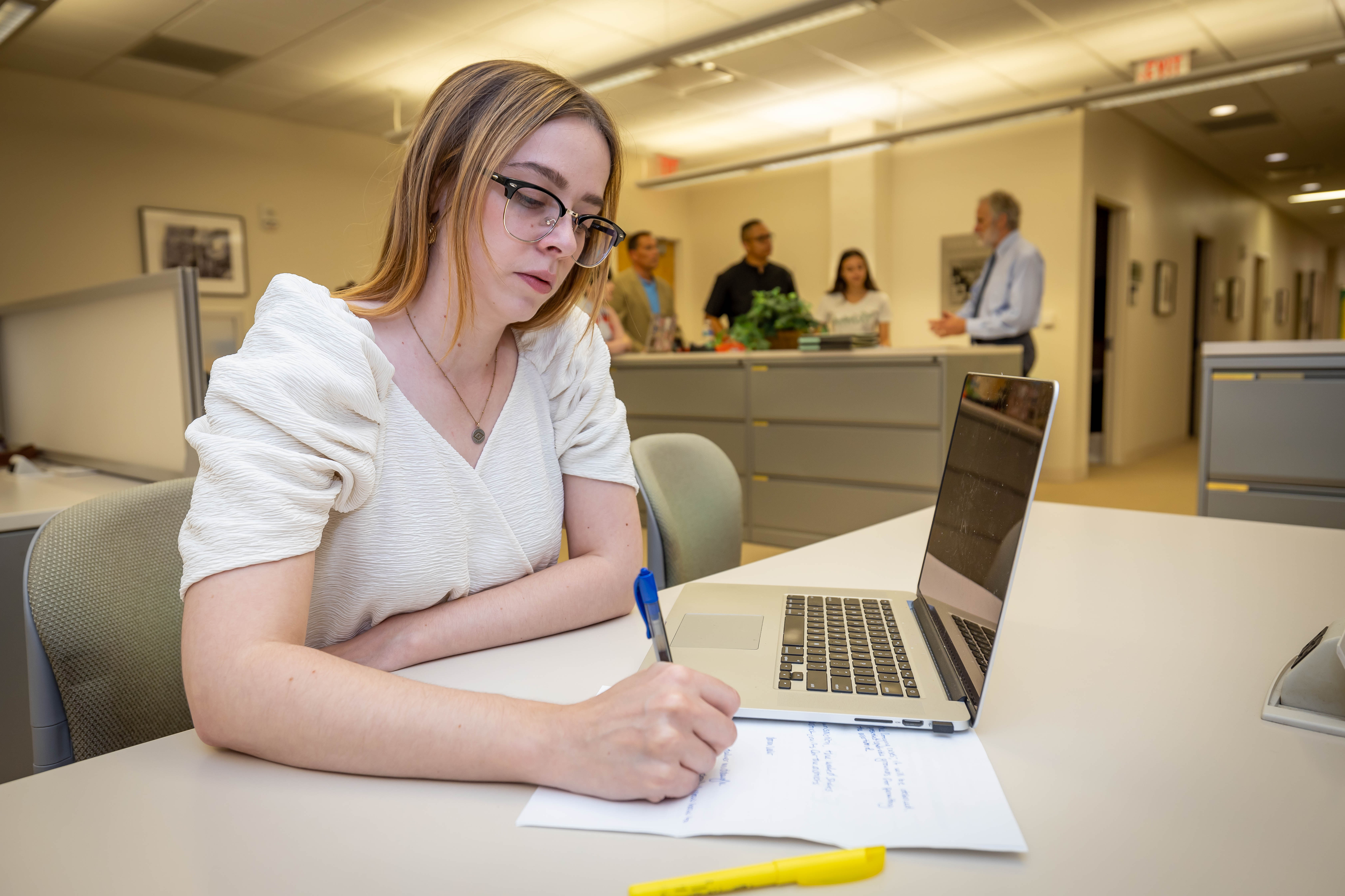 Photo of CSU student and laptop