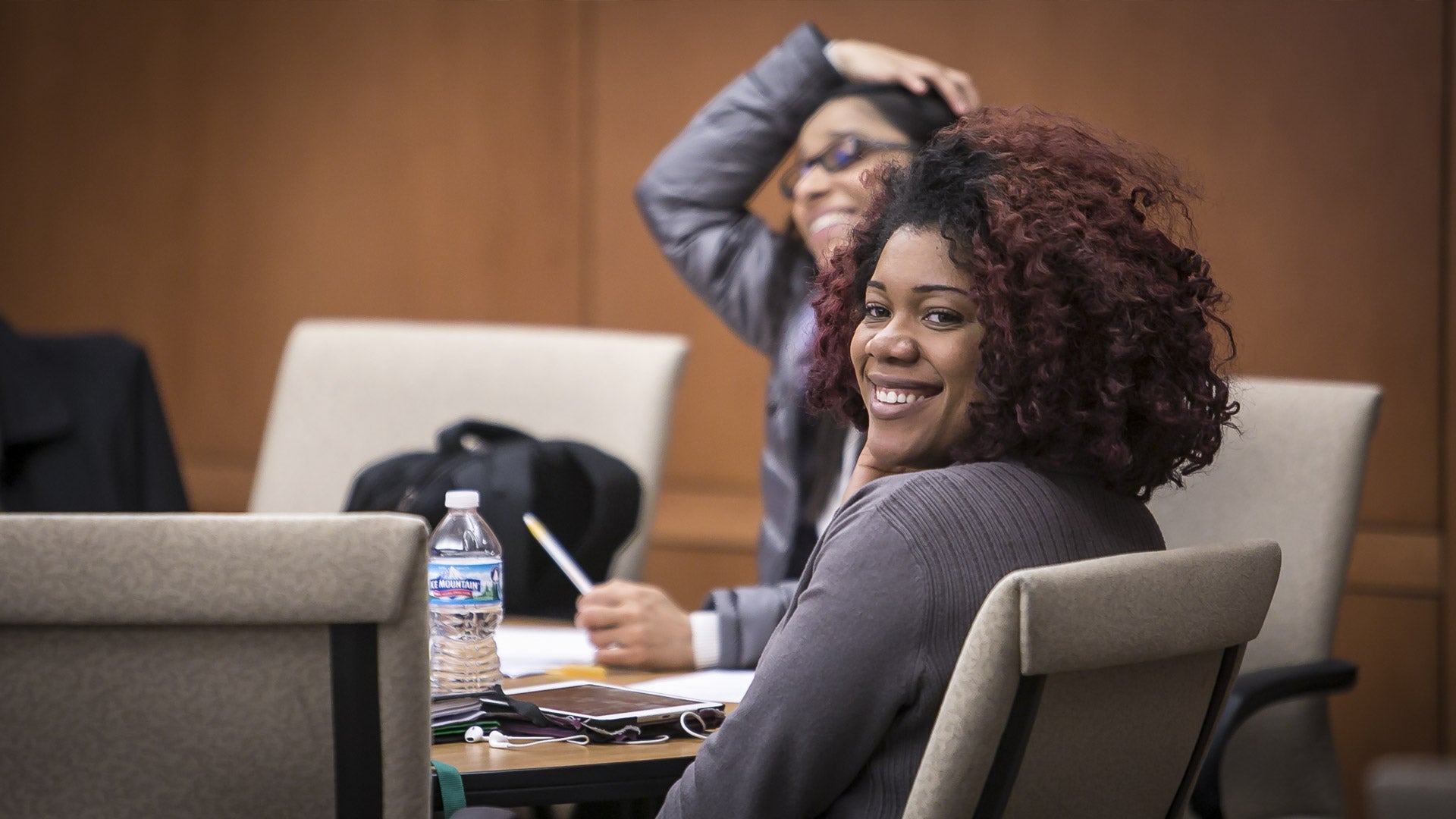 Photo of CSU students seated at a table